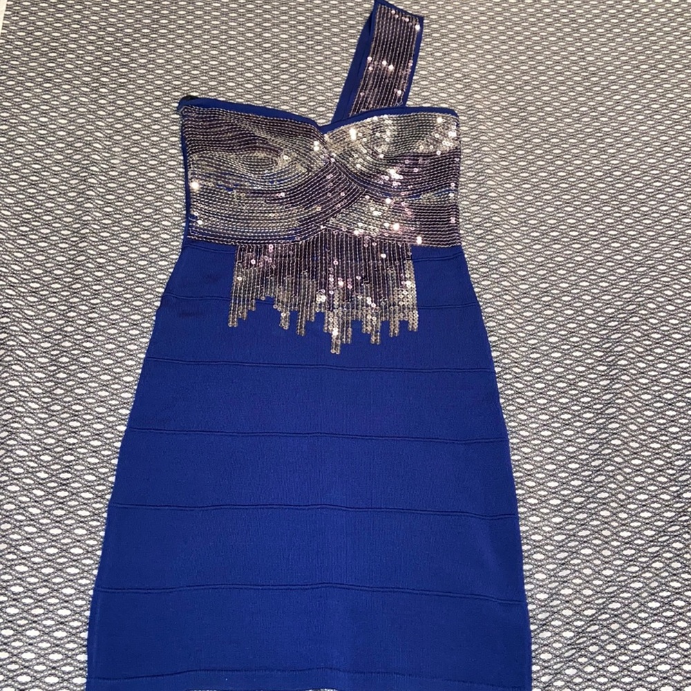 Stunning one shoulder navy blue bandage dress with silver sequence. Size small.